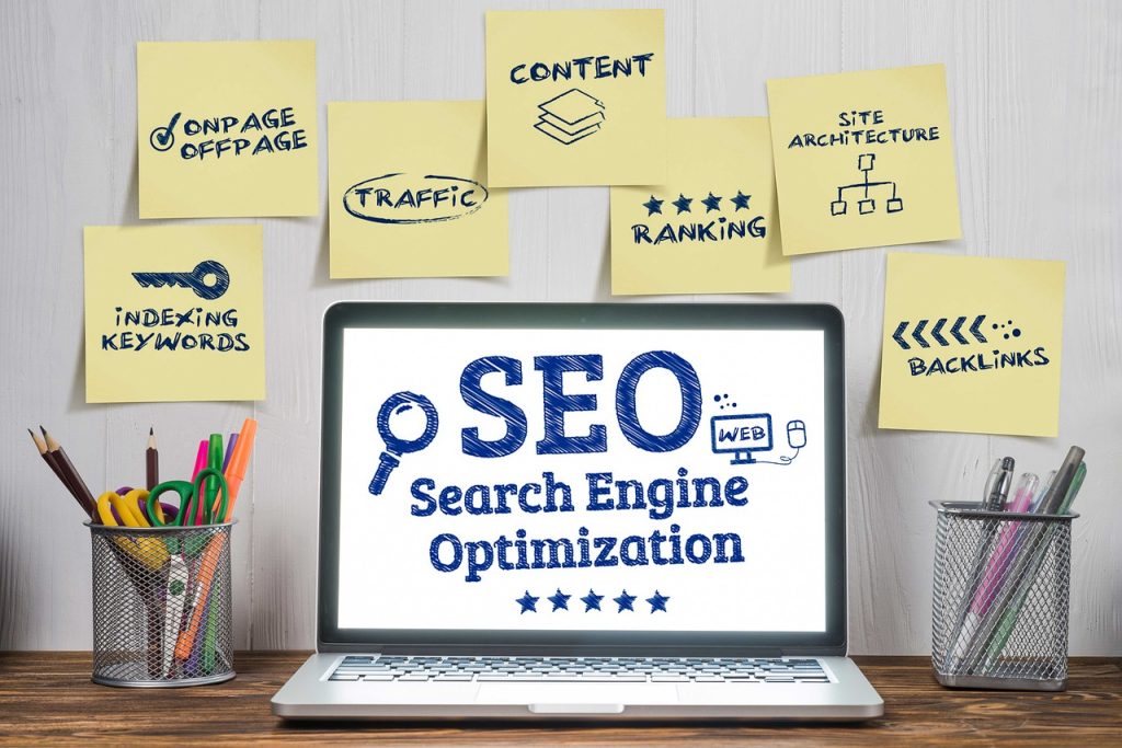 search engine optimization in laptop and in background there are some content traffic ranking